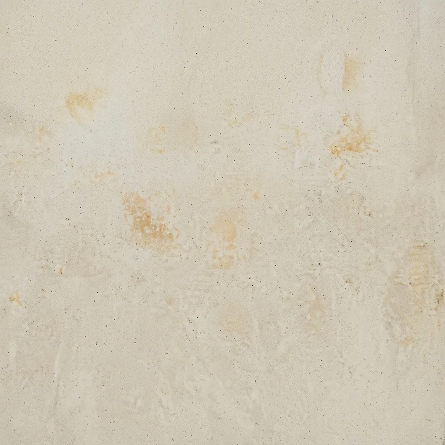 Madaba · Pale cream with a grey cast and soft golden-rust patches